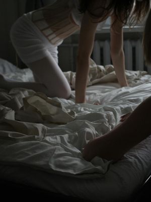 Person doing gentle movements in a dark room